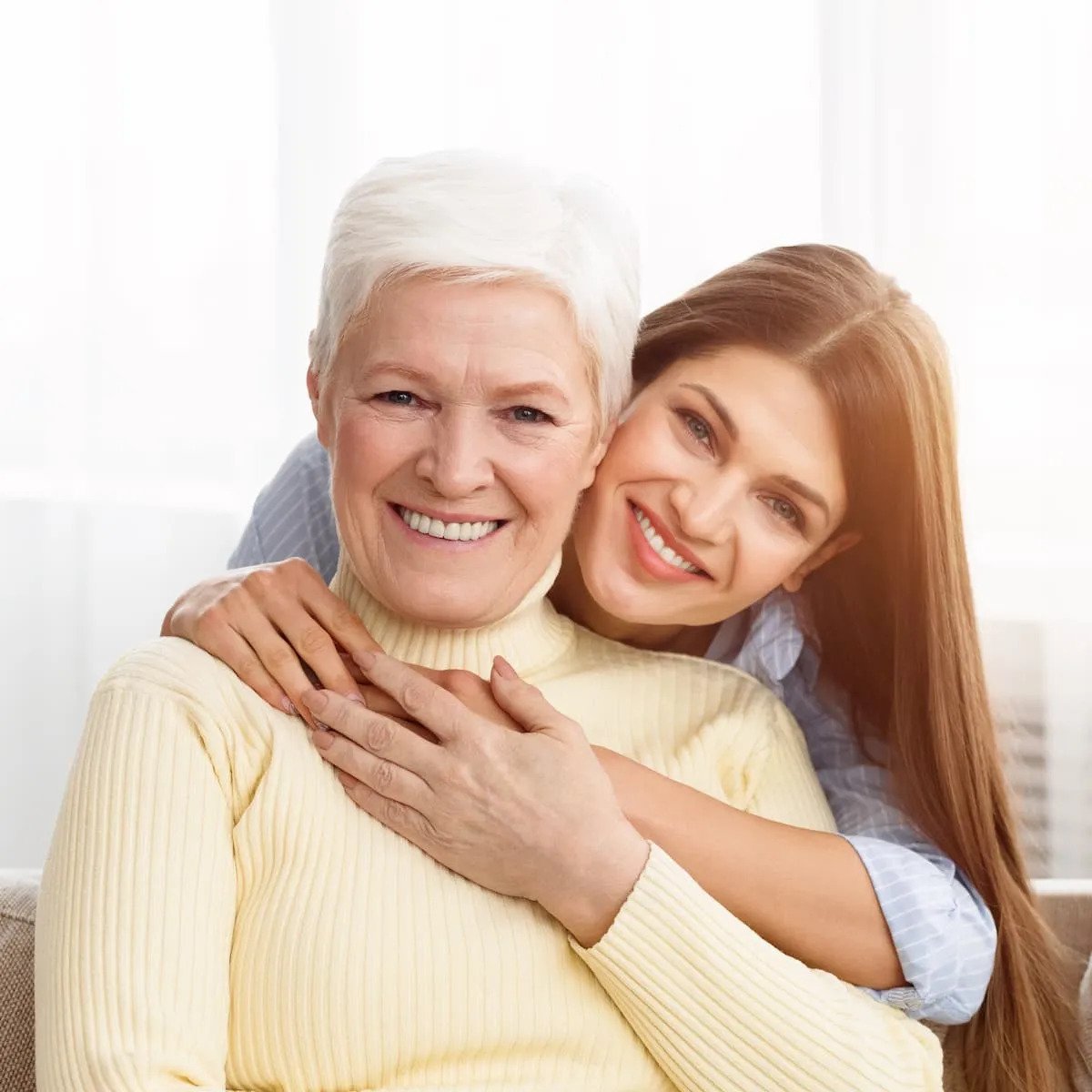 young daughter embracing her mother with love