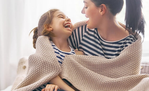 Mother laughing with her child