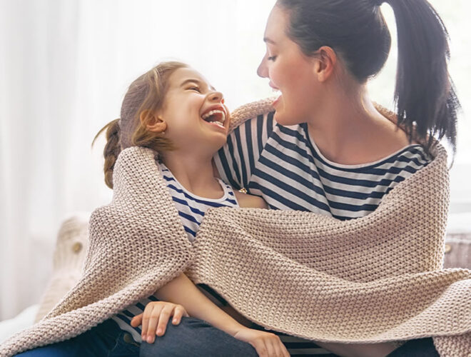 Mother laughing with her child