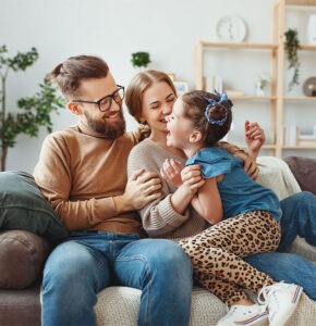 Smiling family with young child