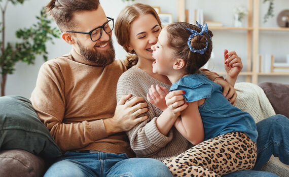 Smiling family with young child