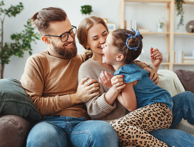 Smiling family with young child