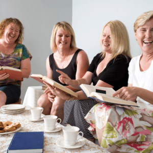 women laughing at book club
