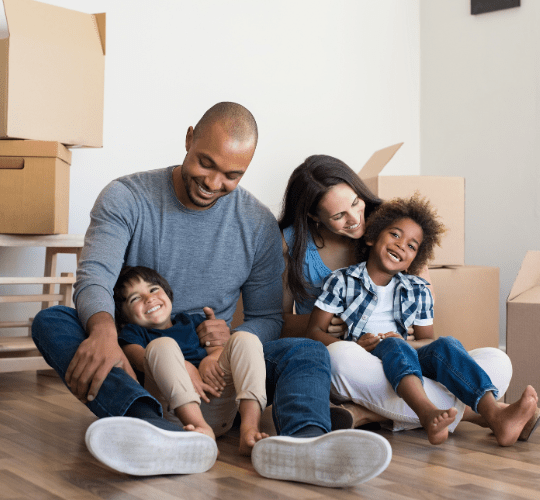 family in their house with moving boxes