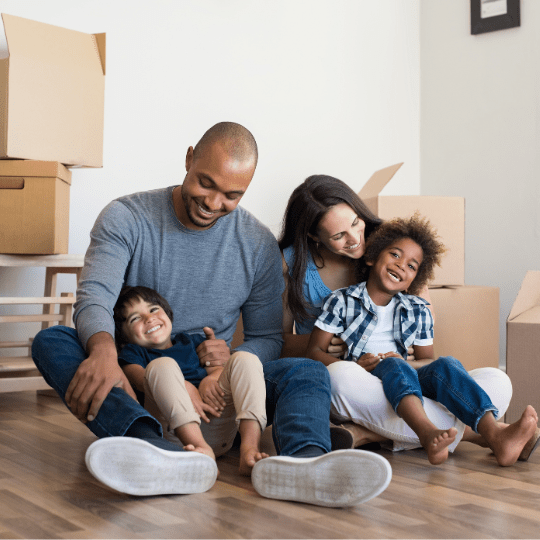 family in their house with moving boxes