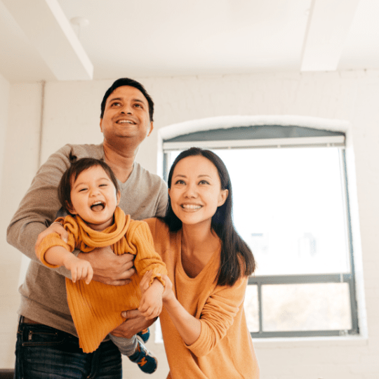 family playing with daughter