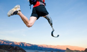 man with prosthetic leg leaping