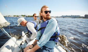 friends on small sail boat