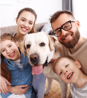 family with their dog