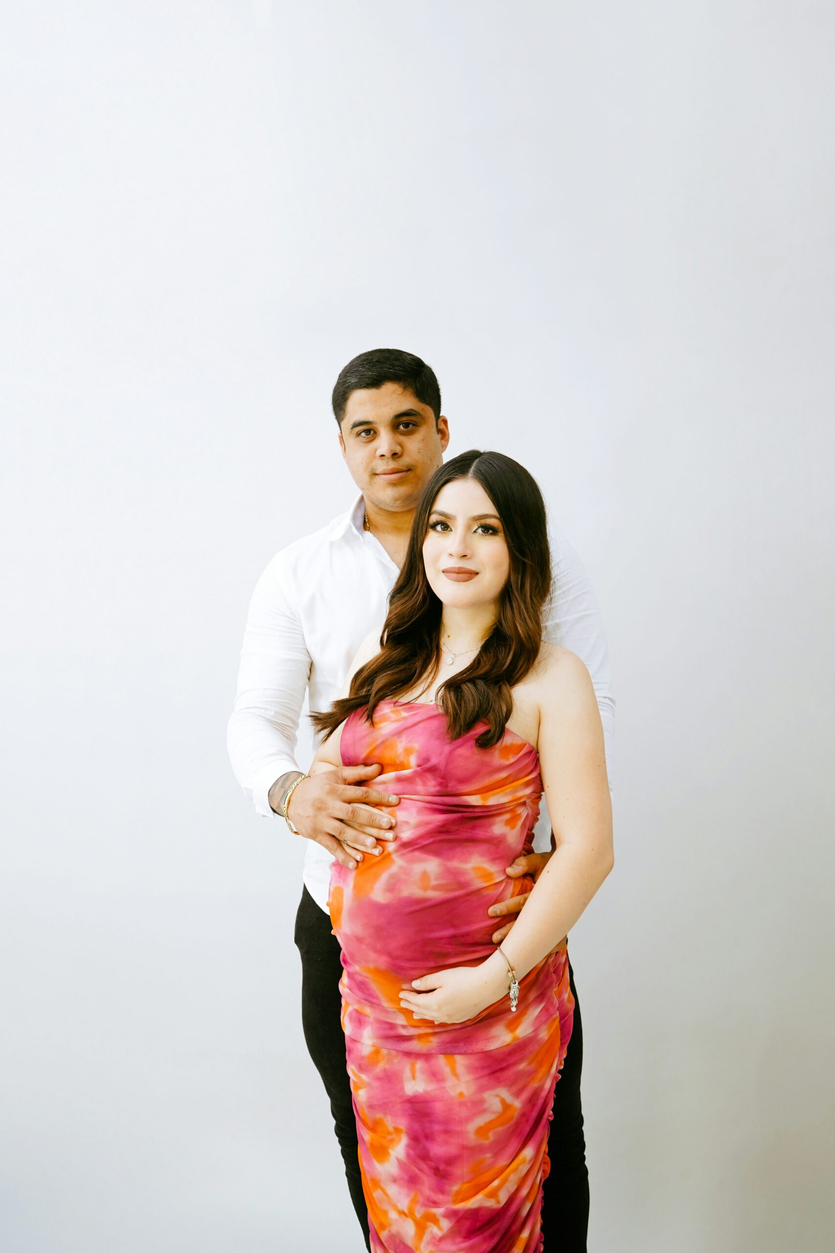 pregnant couple posing